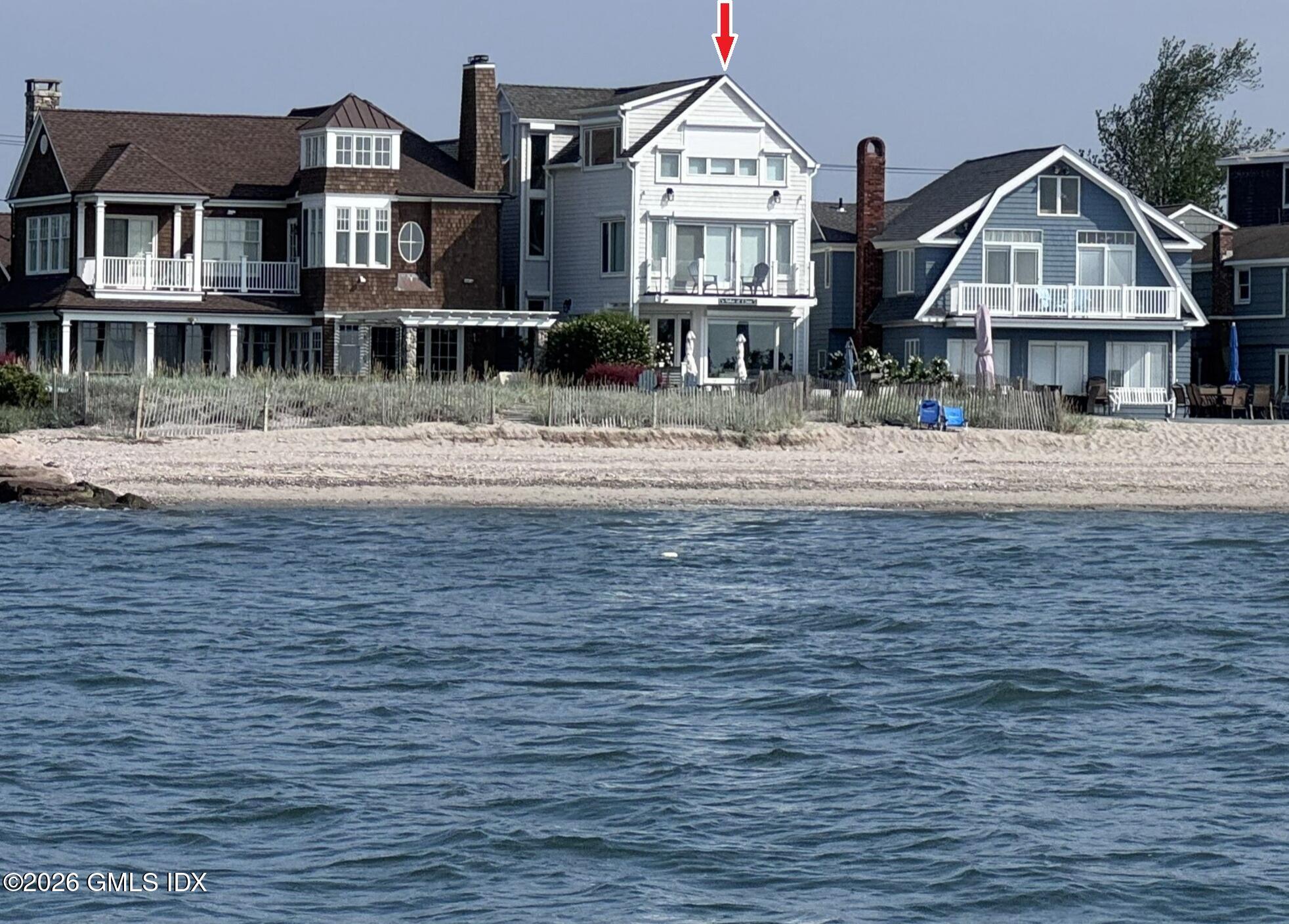 a front view of residential houses with yard