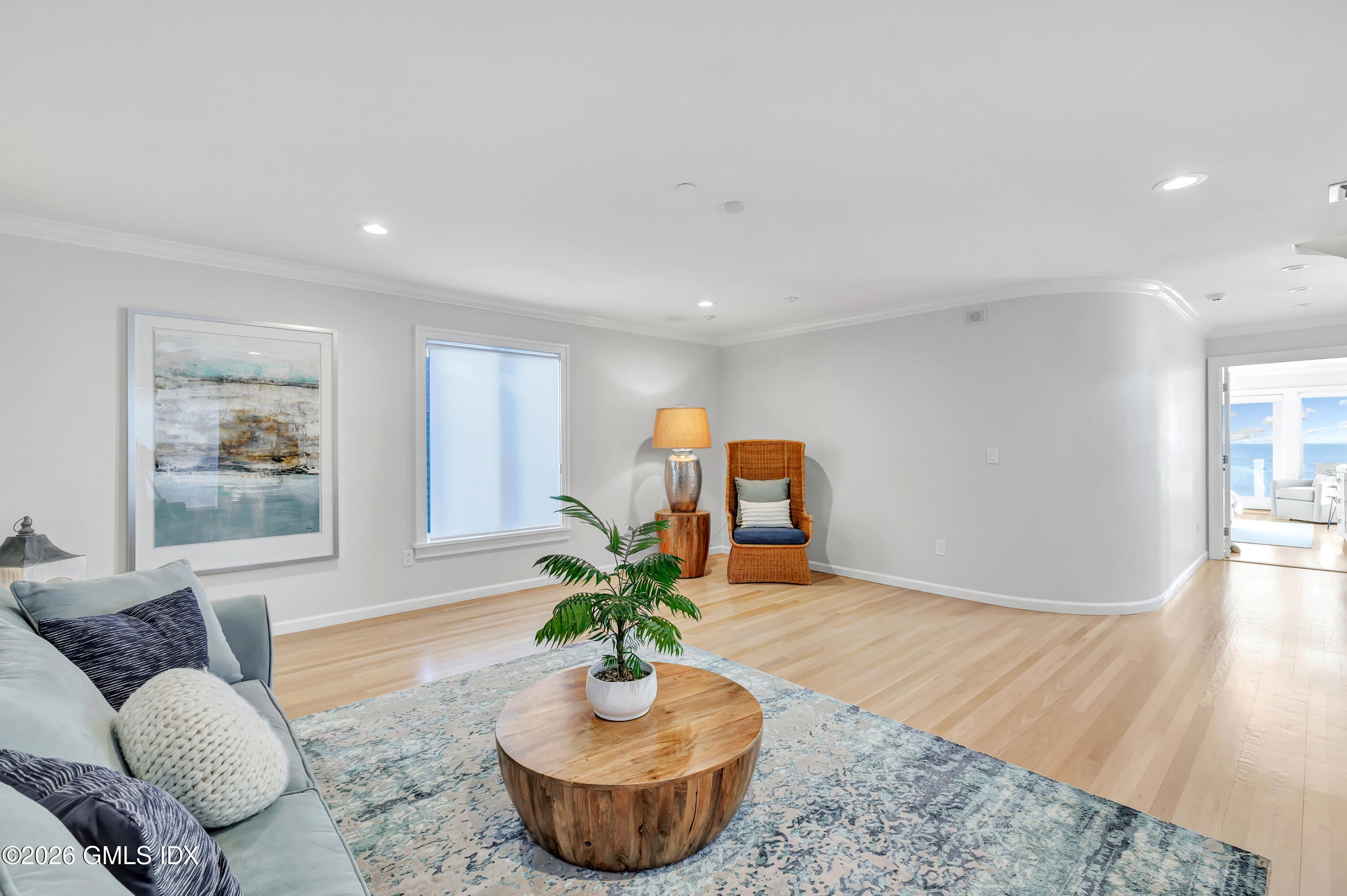 1053 Fairfield Beach Road Fairfield, CT 06824 - Photo 23 of 40 a living room with furniture flowerpot and window