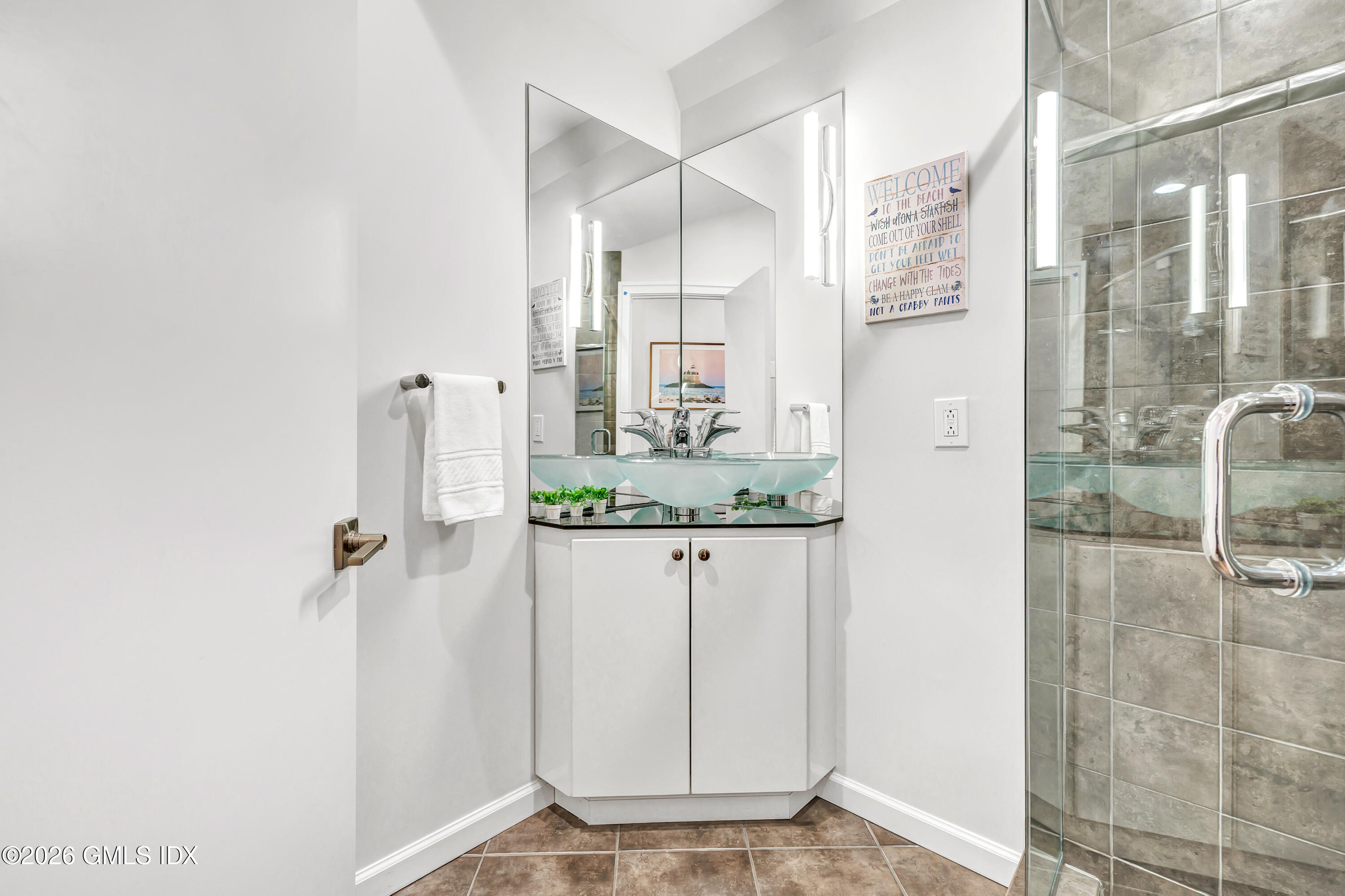 1053 Fairfield Beach Road Fairfield, CT 06824 - Photo 26 of 40 a bathroom with a shower