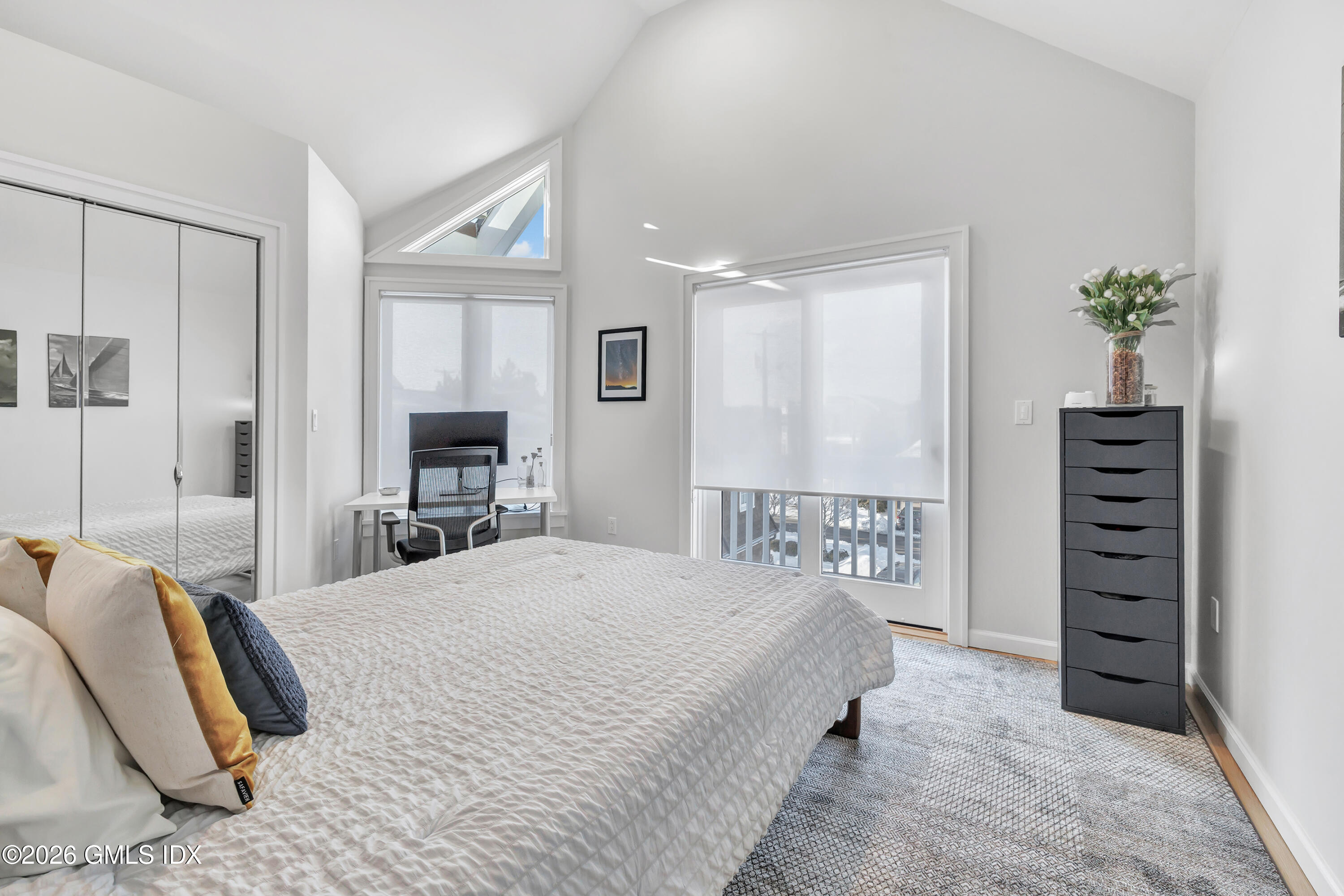 1053 Fairfield Beach Road Fairfield, CT 06824 - Photo 29 of 40 a bedroom with a bed and a television