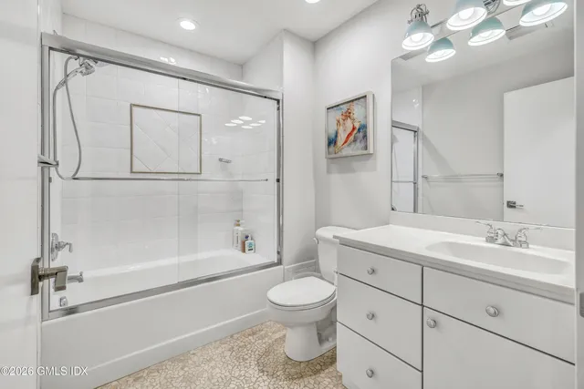 a bathroom with a toilet a sink and a bathtub