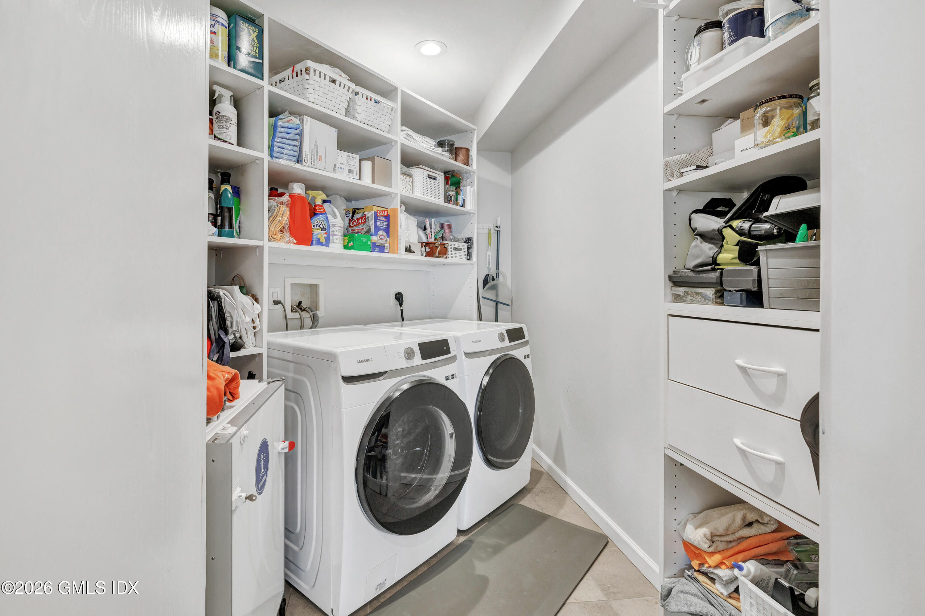 1053 Fairfield Beach Road Fairfield, CT 06824 - Photo 31 of 40 a utility room with dryer and washer