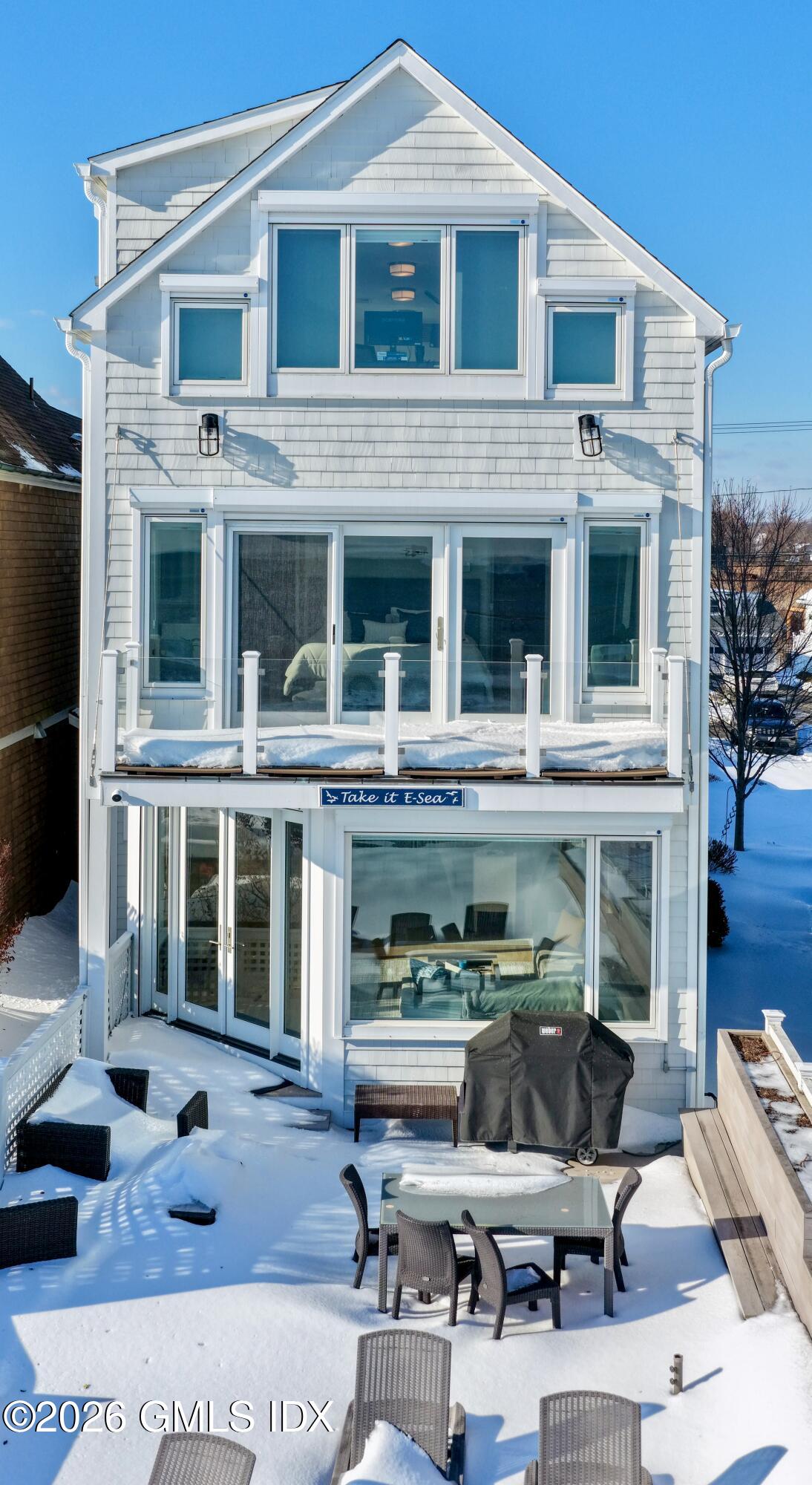 1053 Fairfield Beach Road Fairfield, CT 06824 - Photo 33 of 40 a view of a building with sitting area