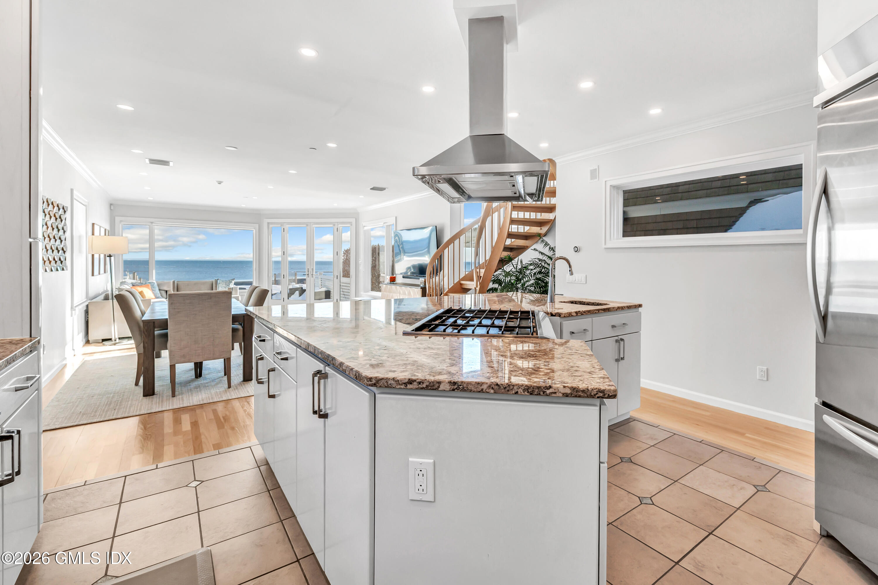 1053 Fairfield Beach Road Fairfield, CT 06824 - Photo 5 of 40 a kitchen with stainless steel appliances granite countertop a sink a stove and a refrigerator