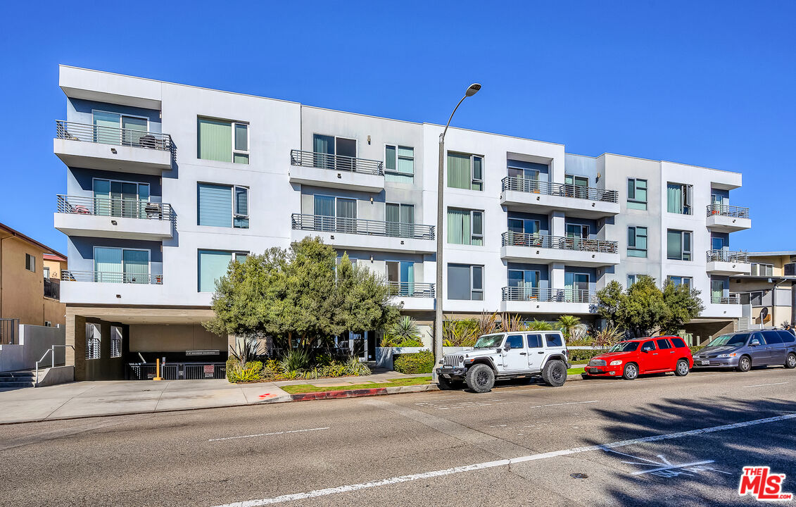 7857 West Manchester Avenue, Unit 201 Playa del Rey, CA 90293 - Photo 1 of 28 a car parked in front of a building