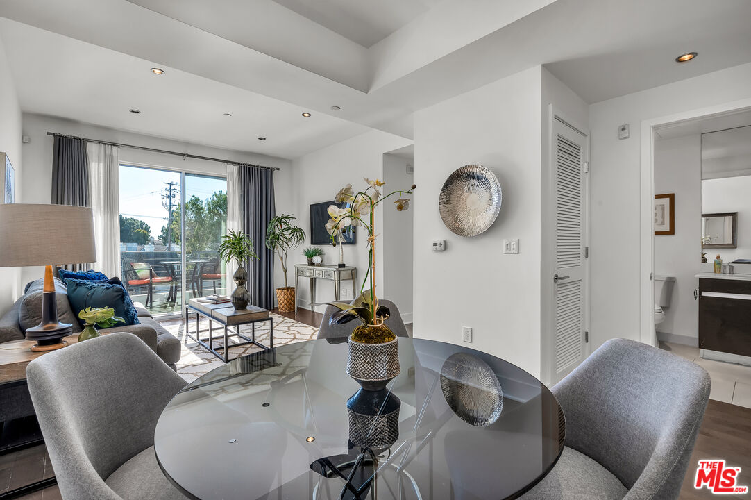 7857 West Manchester Avenue, Unit 201 Playa del Rey, CA 90293 - Photo 13 of 28 a living room with furniture and a large window