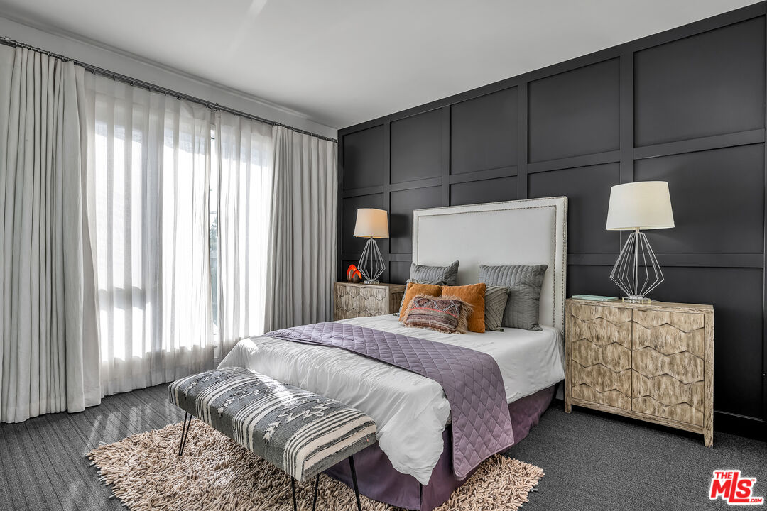 7857 West Manchester Avenue, Unit 201 Playa del Rey, CA 90293 - Photo 18 of 28 a bedroom with a bed a dresser and a window