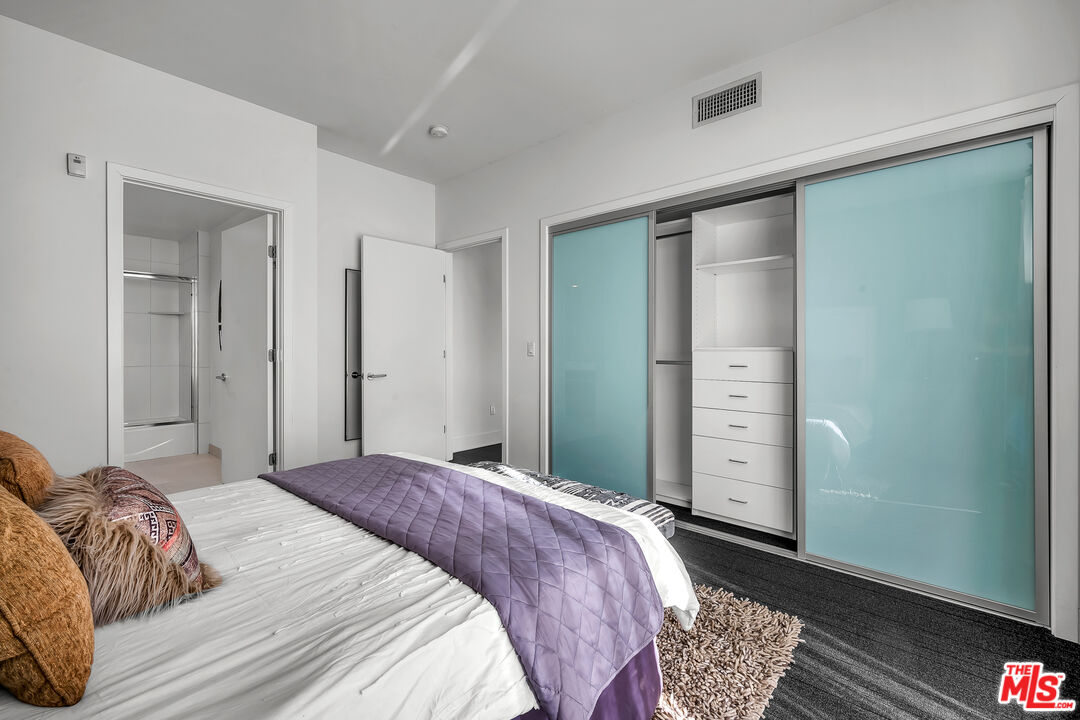 7857 West Manchester Avenue, Unit 201 Playa del Rey, CA 90293 - Photo 19 of 28 a bedroom with a bed and a closet