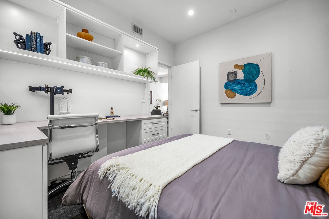 7857 West Manchester Avenue, Unit 201 Playa del Rey, CA 90293 - Photo 22 of 28 a bedroom with a bed and a dresser