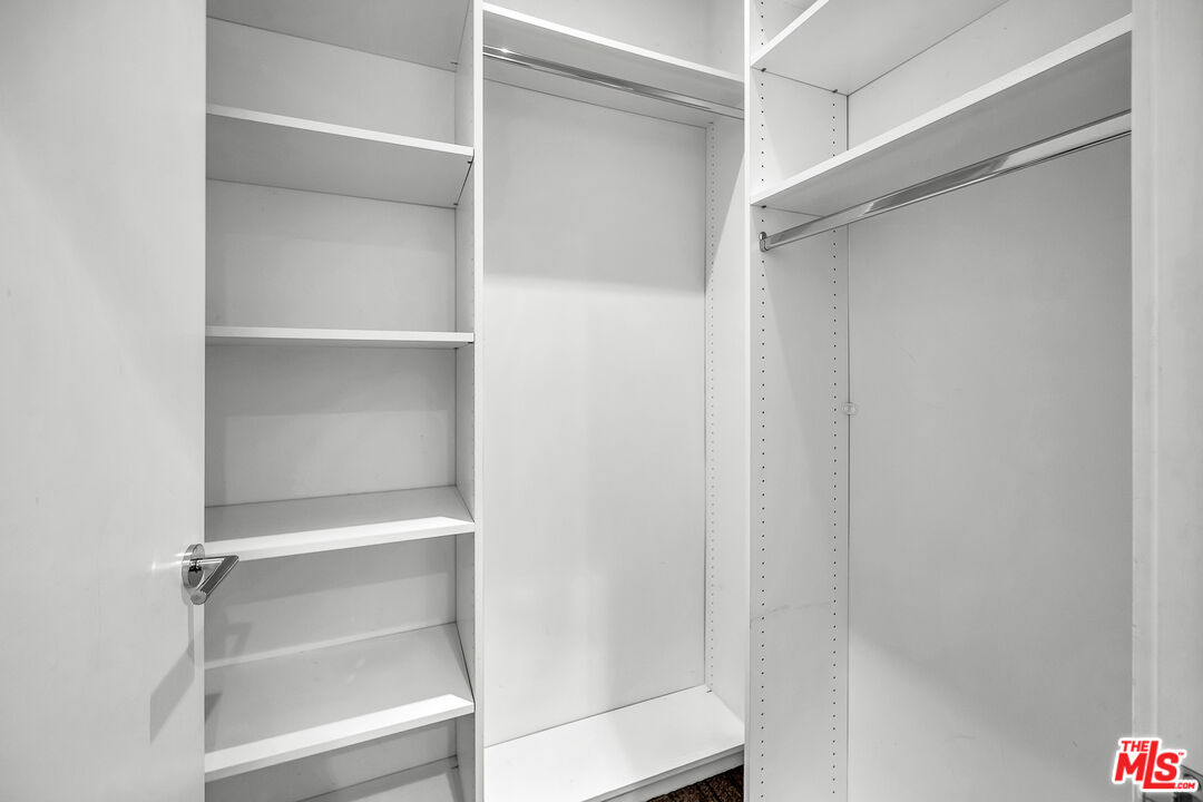 7857 West Manchester Avenue, Unit 201 Playa del Rey, CA 90293 - Photo 23 of 28 a view of walk in closet with empty racks