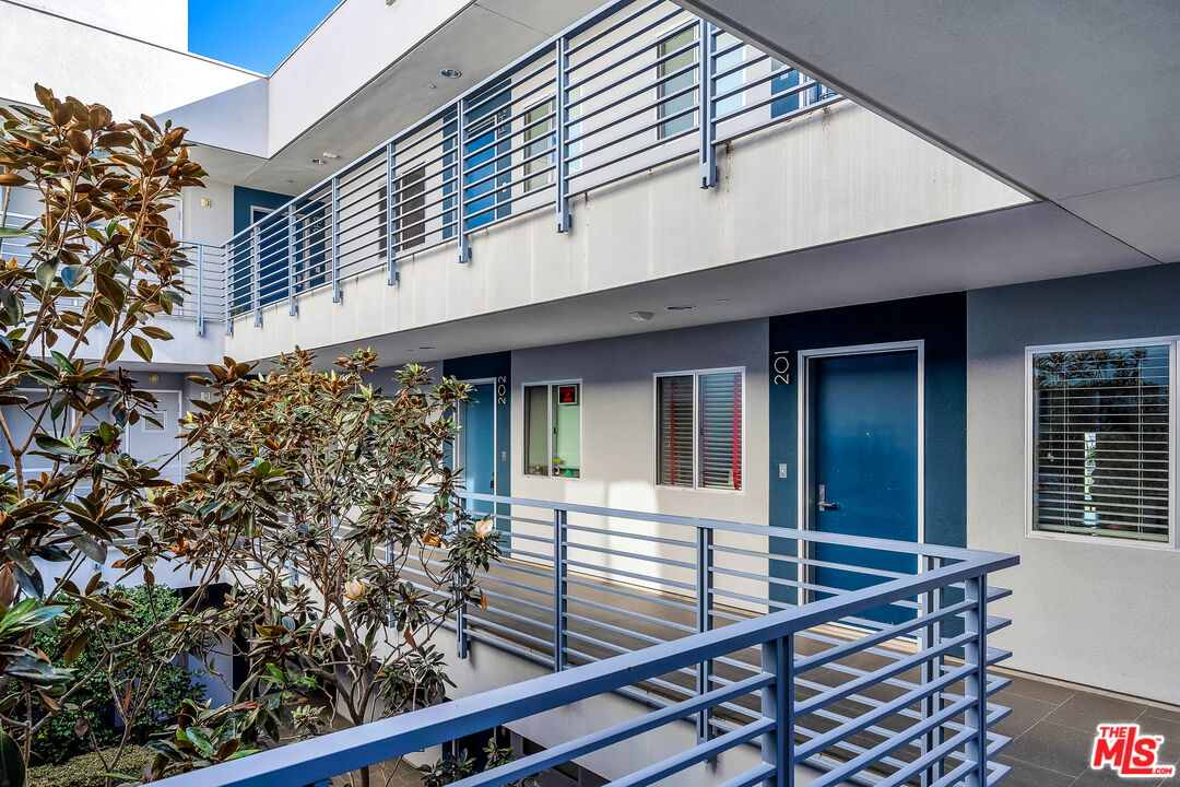 7857 West Manchester Avenue, Unit 201 Playa del Rey, CA 90293 - Photo 4 of 28 a view of a house with roof and sitting area