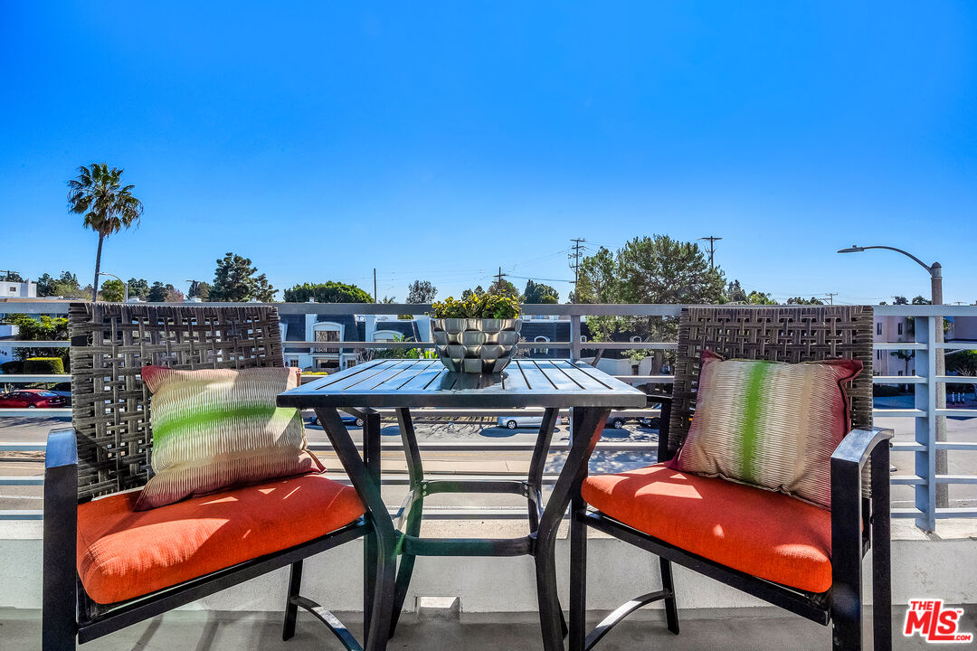 7857 West Manchester Avenue, Unit 201 Playa del Rey, CA 90293 - Photo 9 of 28 a view of a chairs and table in patio