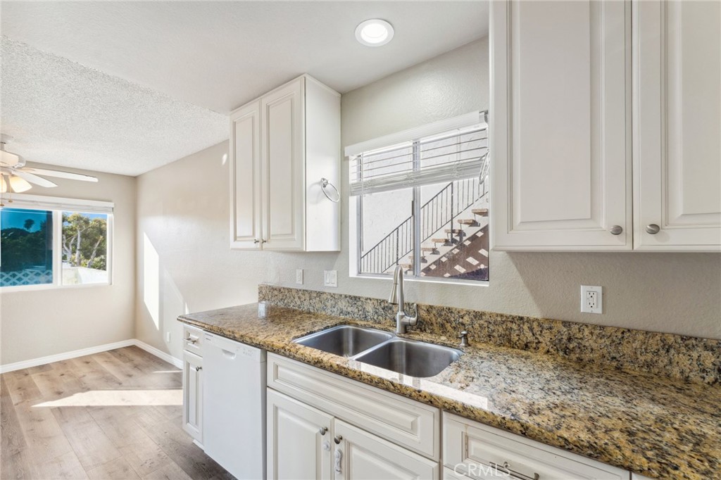 34602 Calle Rosita, Unit A Dana Point, CA 92624 - Photo 12 of 27 a kitchen with a sink and cabinets