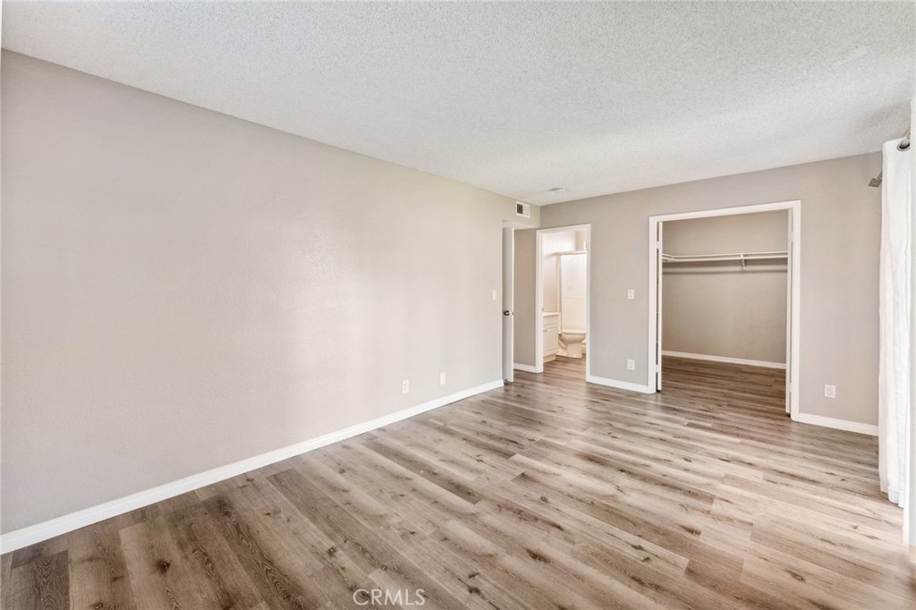 34602 Calle Rosita, Unit A Dana Point, CA 92624 - Photo 21 of 27 a view of an empty room and wooden floor