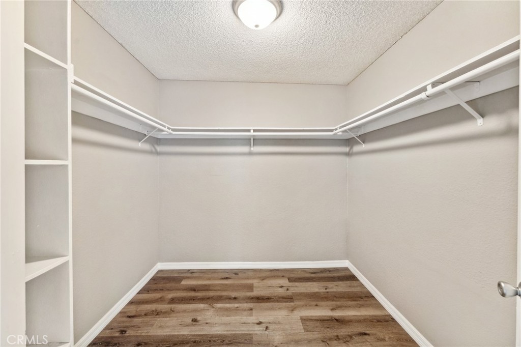 34602 Calle Rosita, Unit A Dana Point, CA 92624 - Photo 22 of 27 a view of a room with wooden floor