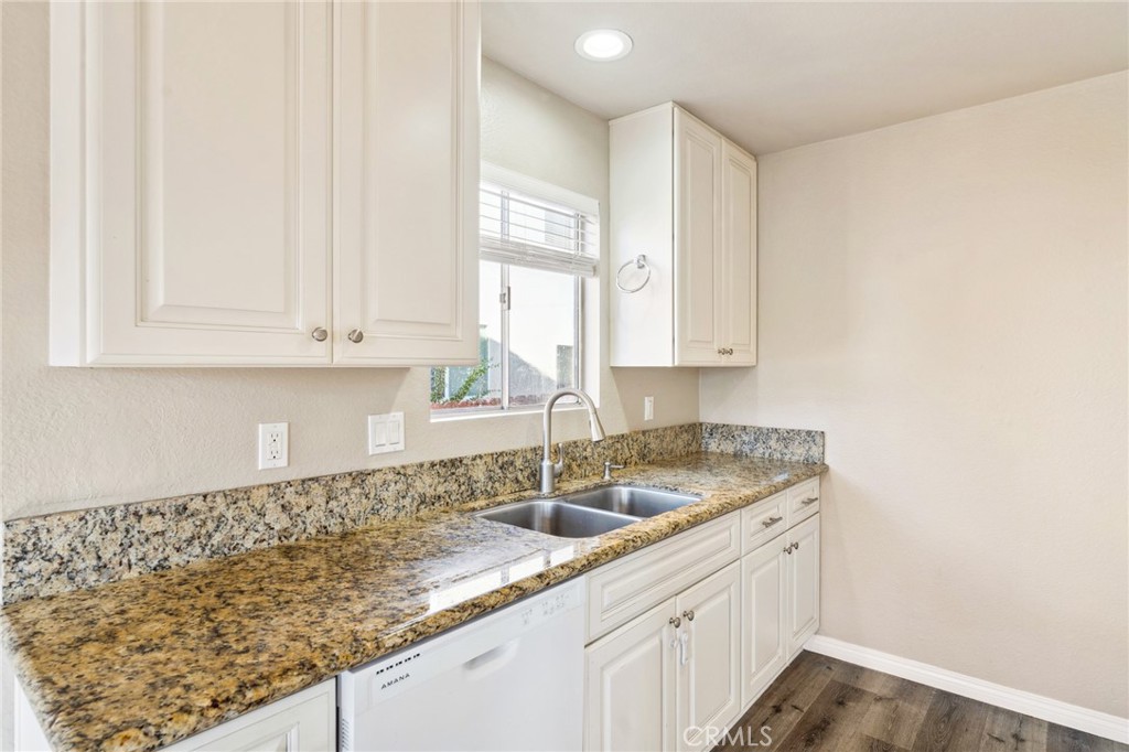 34602 Calle Rosita, Unit A Dana Point, CA 92624 - Photo 8 of 27 a kitchen with a sink and cabinets