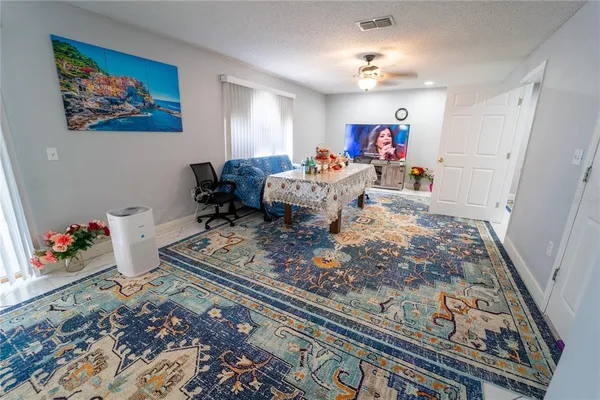 a living room with furniture and a rug