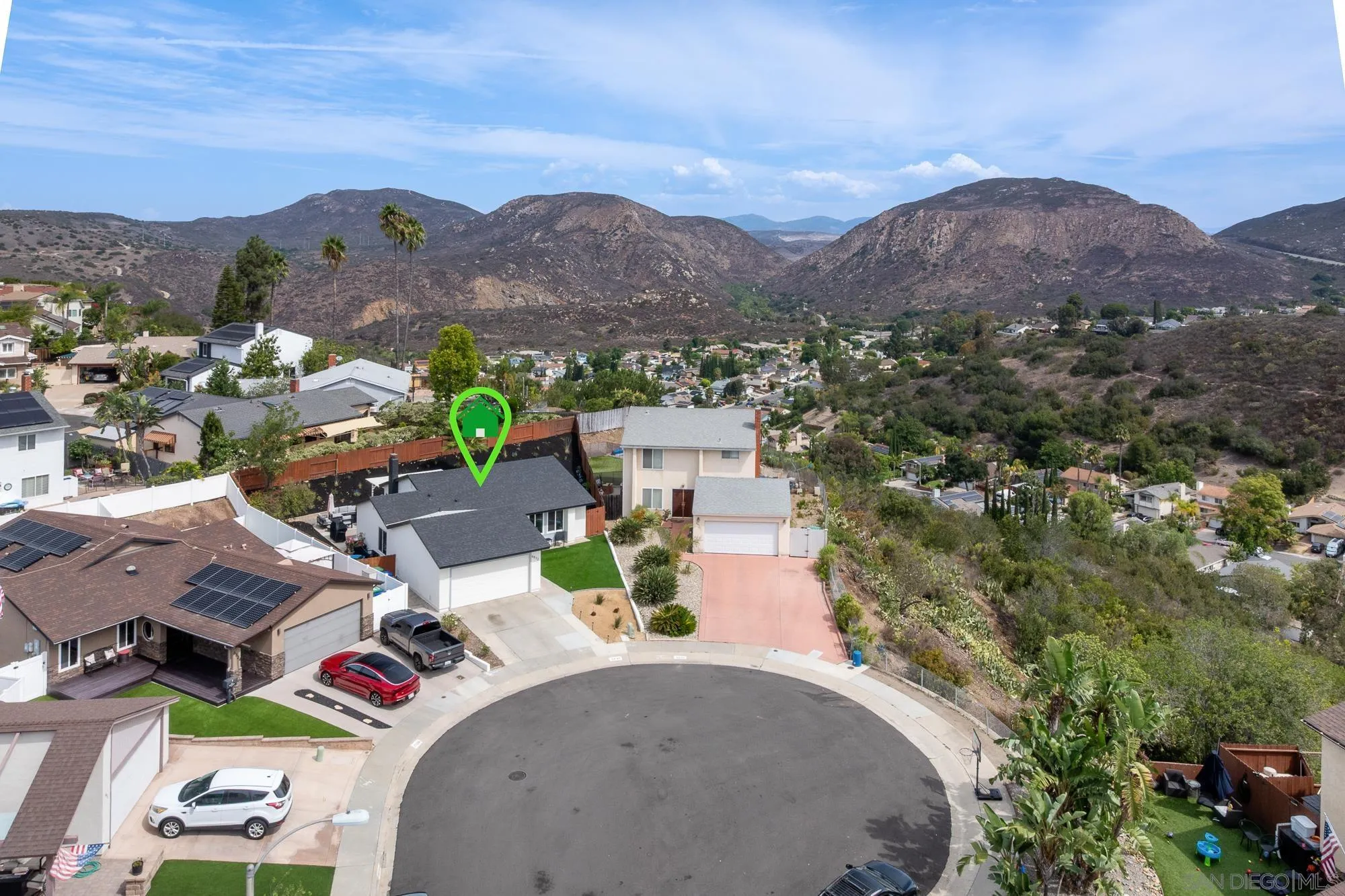 6832 Lazy Clouds San Diego, CA 92120 - Photo 3 of 45 an aerial view of a house with a mountain