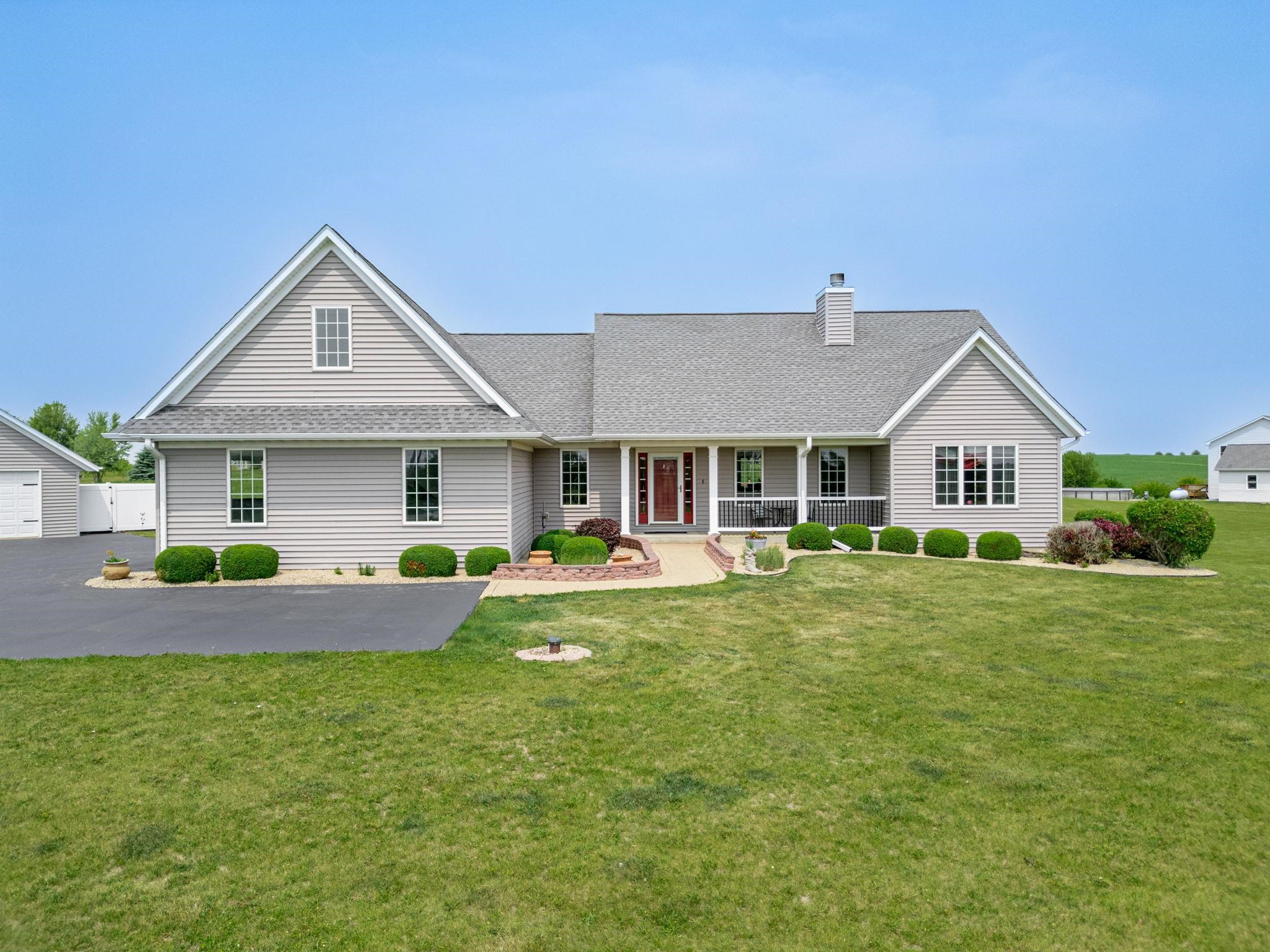 3535 North Keith Road Pecatonica, IL 61063 - Photo 1 of 47 a front view of house with yard and porch