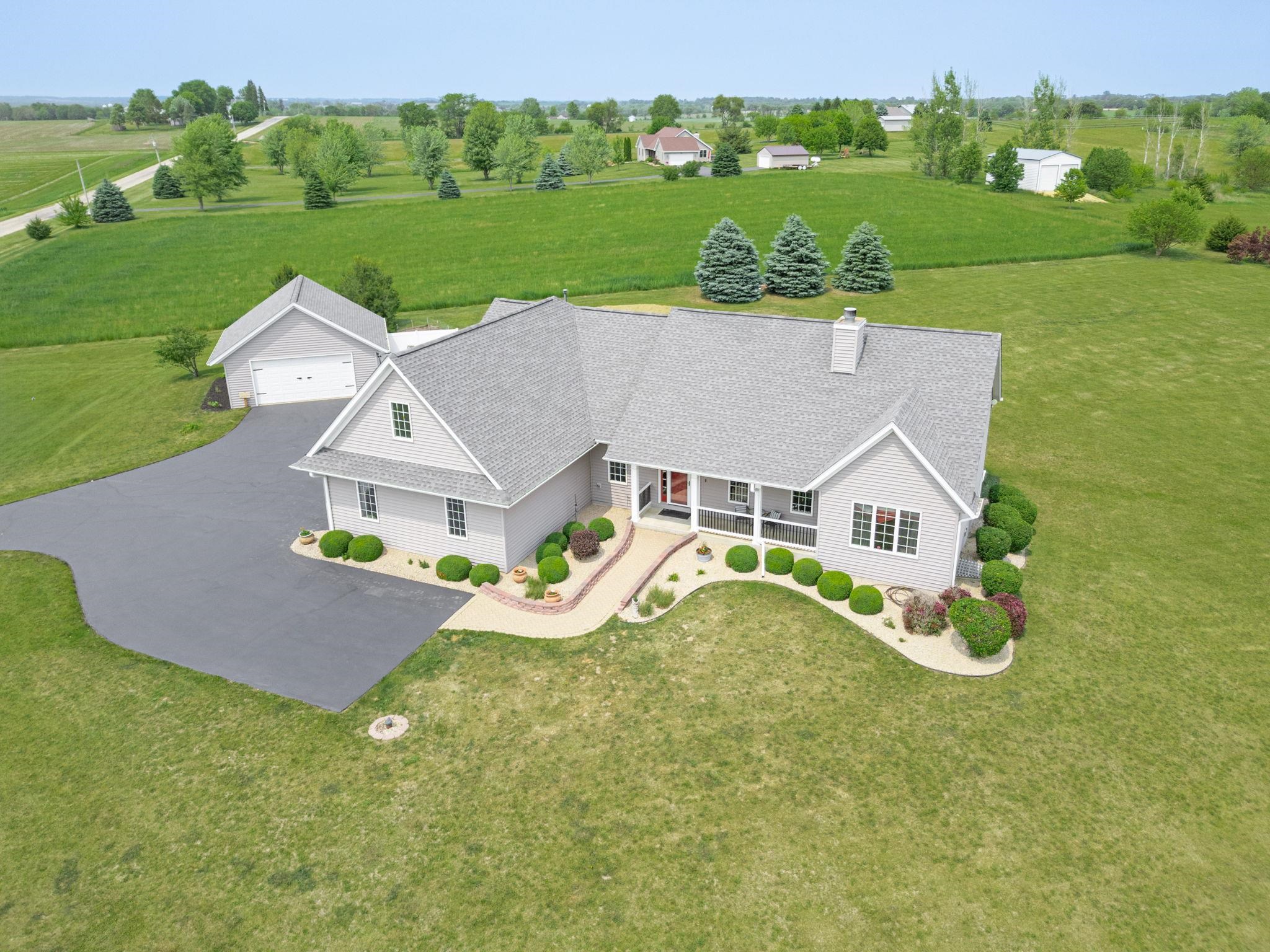 3535 North Keith Road Pecatonica, IL 61063 - Photo 2 of 47 an aerial view of a house with a garden and swimming pool