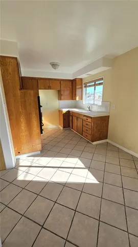 a living room with a black white checkered floor
