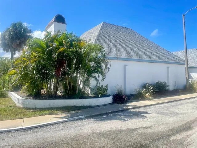 a view of a lake with a house in the background
