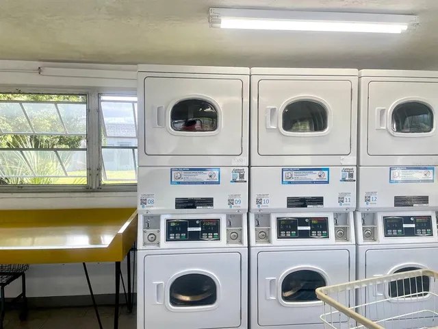 a living room with furniture pool table and chair