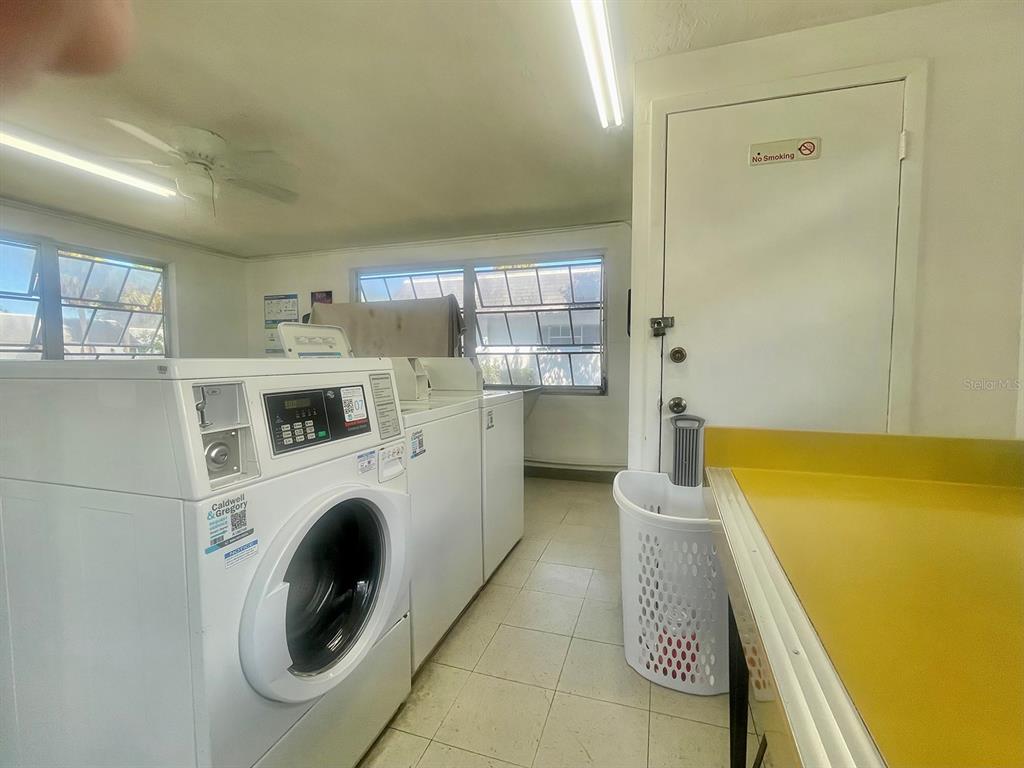 4211 Sheldon Place, Unit 4211 New Port Richey, FL 34652 - Photo 38 of 58 a utility room with dryer and washer