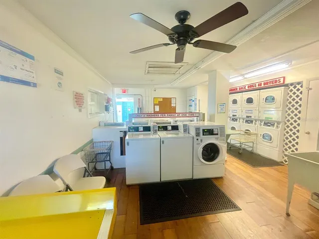 a view of a swimming pool with lounge chairs