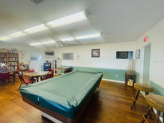 a view of a swimming pool with a yard