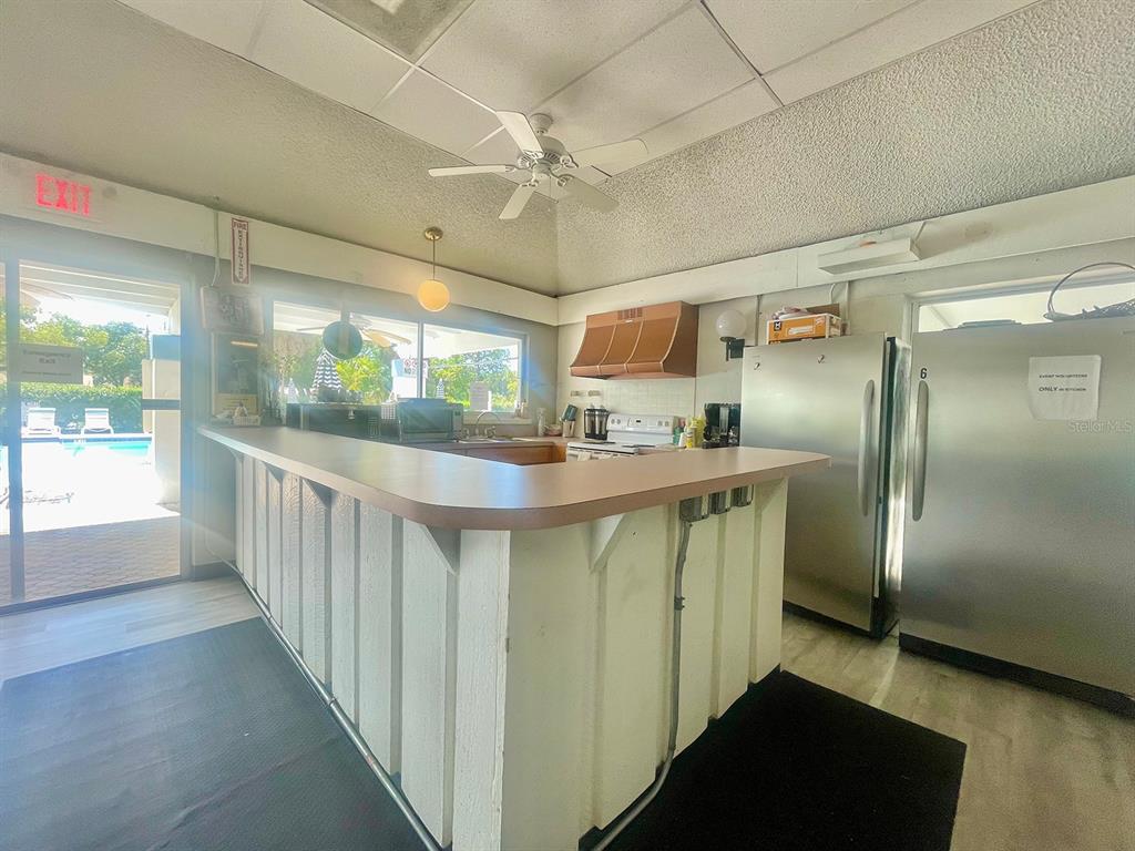 4211 Sheldon Place, Unit 4211 New Port Richey, FL 34652 - Photo 46 of 58 a kitchen with stainless steel appliances a refrigerator and a stove