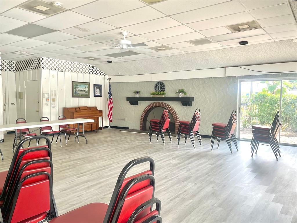 4211 Sheldon Place, Unit 4211 New Port Richey, FL 34652 - Photo 47 of 58 a living room with furniture and a wooden floor