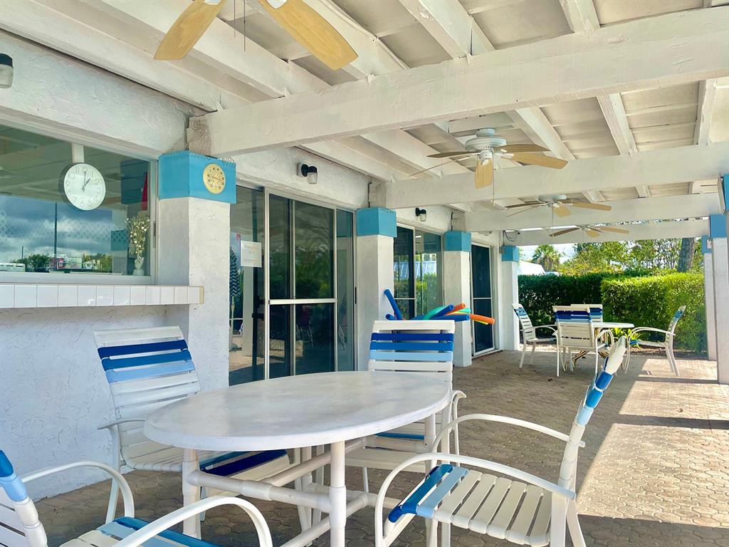 4211 Sheldon Place, Unit 4211 New Port Richey, FL 34652 - Photo 49 of 58 a view of a dining room with furniture window and outside view