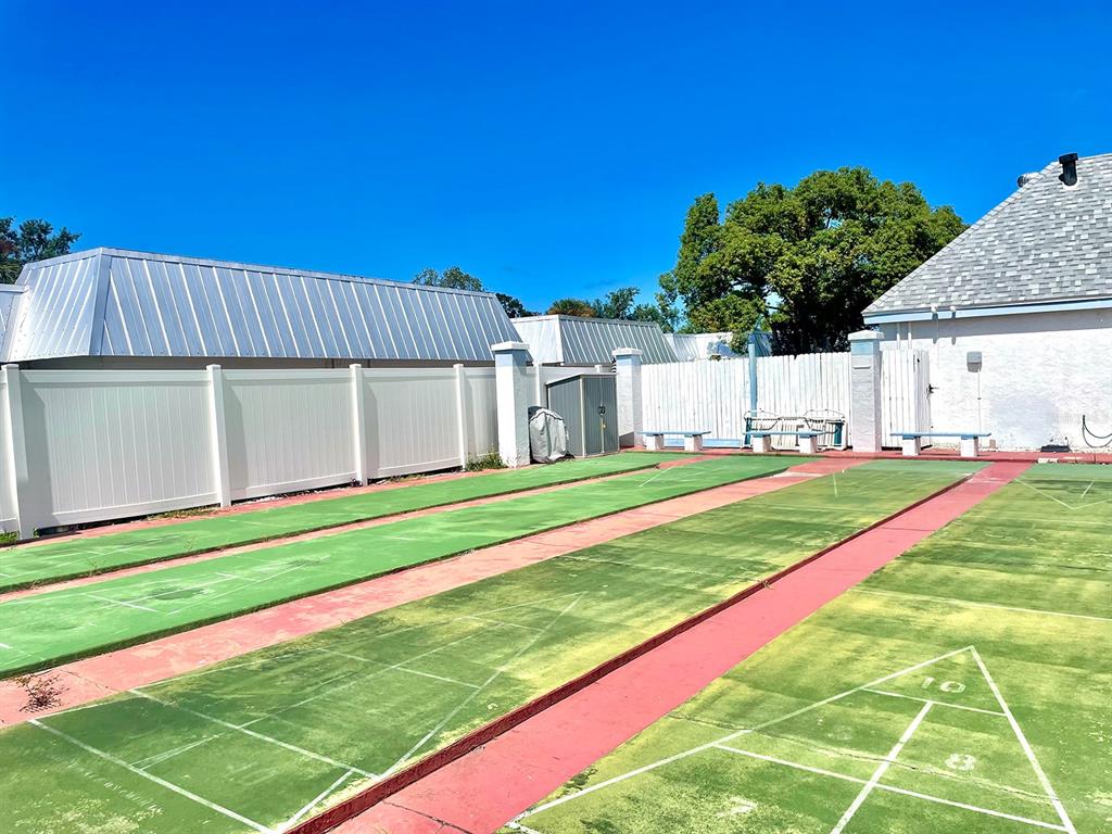 4211 Sheldon Place, Unit 4211 New Port Richey, FL 34652 - Photo 54 of 58 a view of backyard with trampoline