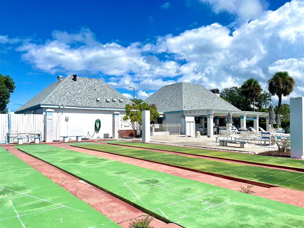 4211 Sheldon Place, Unit 4211 New Port Richey, FL 34652 - Photo 55 of 58 a front view of a house with a yard