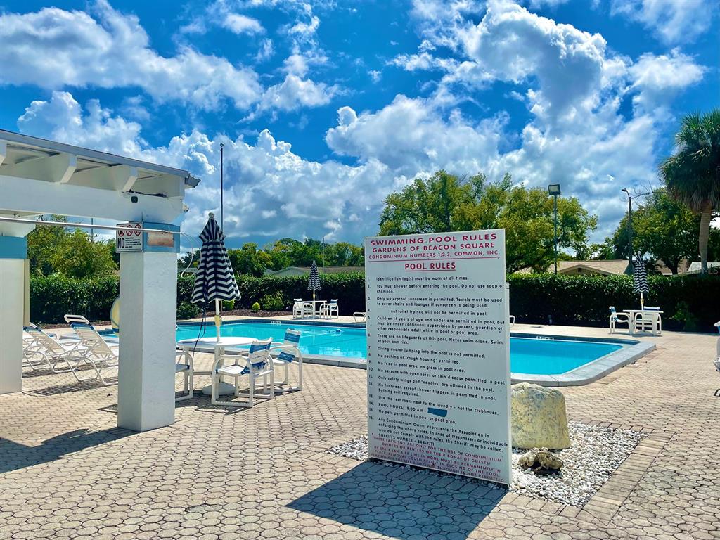 4211 Sheldon Place, Unit 4211 New Port Richey, FL 34652 - Photo 58 of 58 a view of a patio with a table and chairs