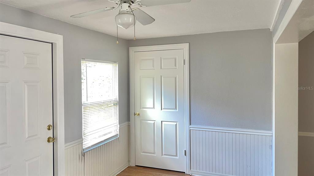 4211 Sheldon Place, Unit 4211 New Port Richey, FL 34652 - Photo 8 of 58 a view of empty room with wooden floor and fan