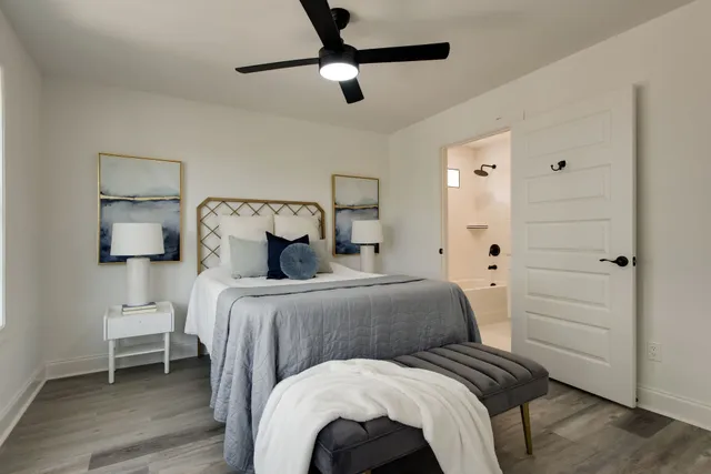 a bedroom with a bed and a table