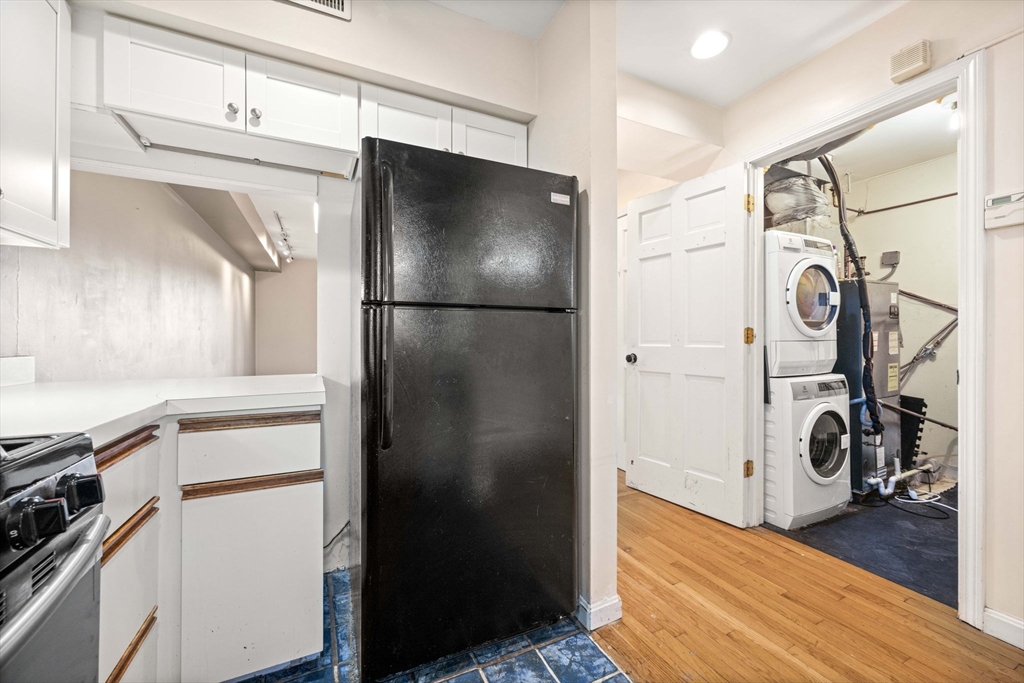 36 Cummings Road, Unit 10 Boston, MA 02135 - Photo 9 of 17 a kitchen with a refrigerator and a stove top oven