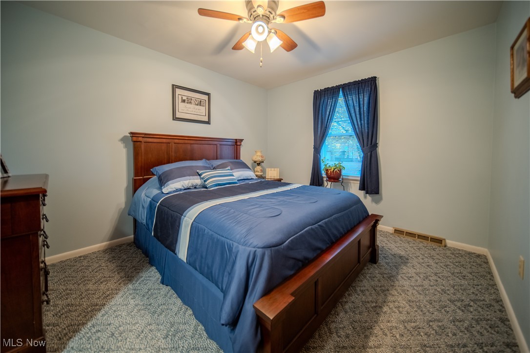 3447 Marian Road Ravenna, OH 44266 - Photo 15 of 35 Bedroom with carpet floors and ceiling fan