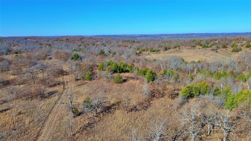 0 N3840 Road Coalgate, OK 74538 - Photo 12 of 40 a view of a dry field with trees in background