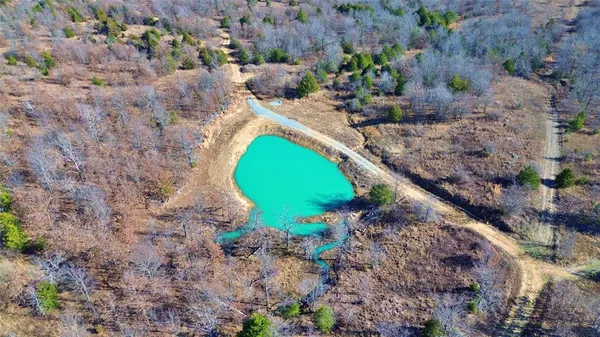 a view of a swimming pool with a yard and mountain view