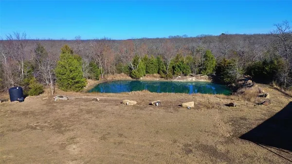 an aerial view of a house with mountain view