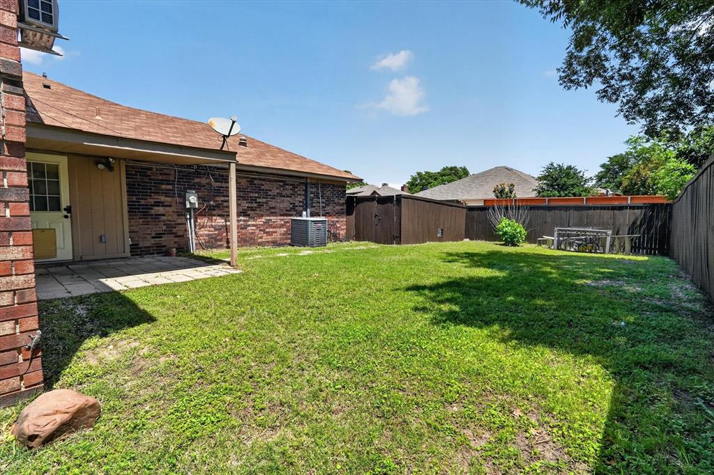 272 Lodge Road Coppell, TX 75019 - Photo 19 of 24 a view of a house with a yard and sitting area