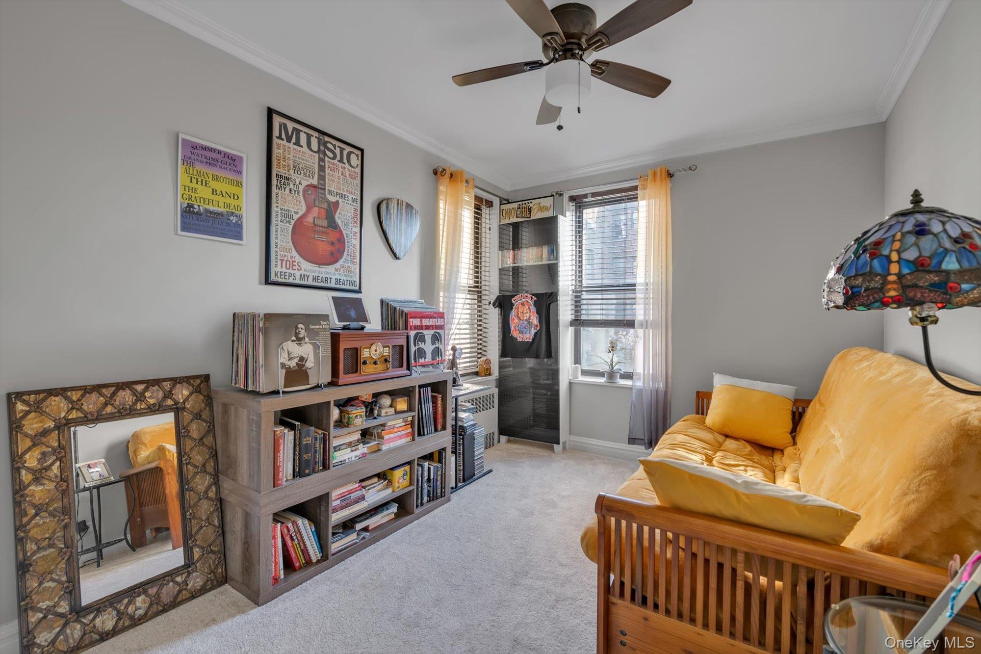 83-25 98th Street, Unit 4L Queens, NY 11421 - Photo 11 of 14 Sitting room featuring crown molding, light carpet, a ceiling fan, and radiator