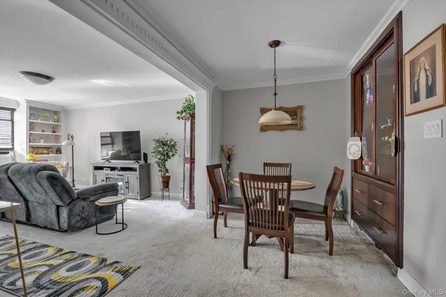 a dining room with furniture and window