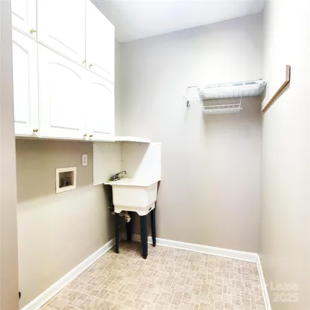 a view of a room with a table and chairs