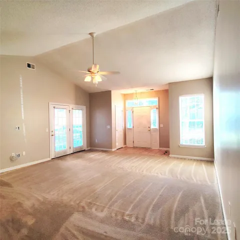 a view of a room with window and stairs