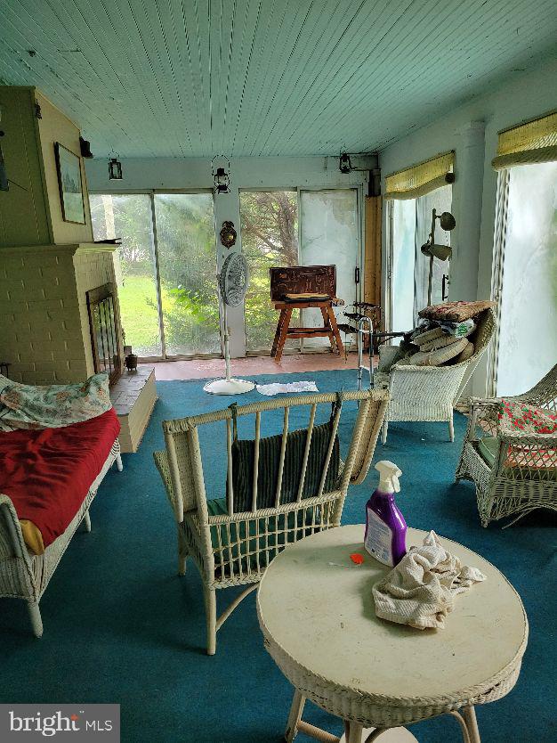 312 Front Street Dover, DE 19901 - Photo 11 of 15 a dining room with furniture a rug and wooden floor