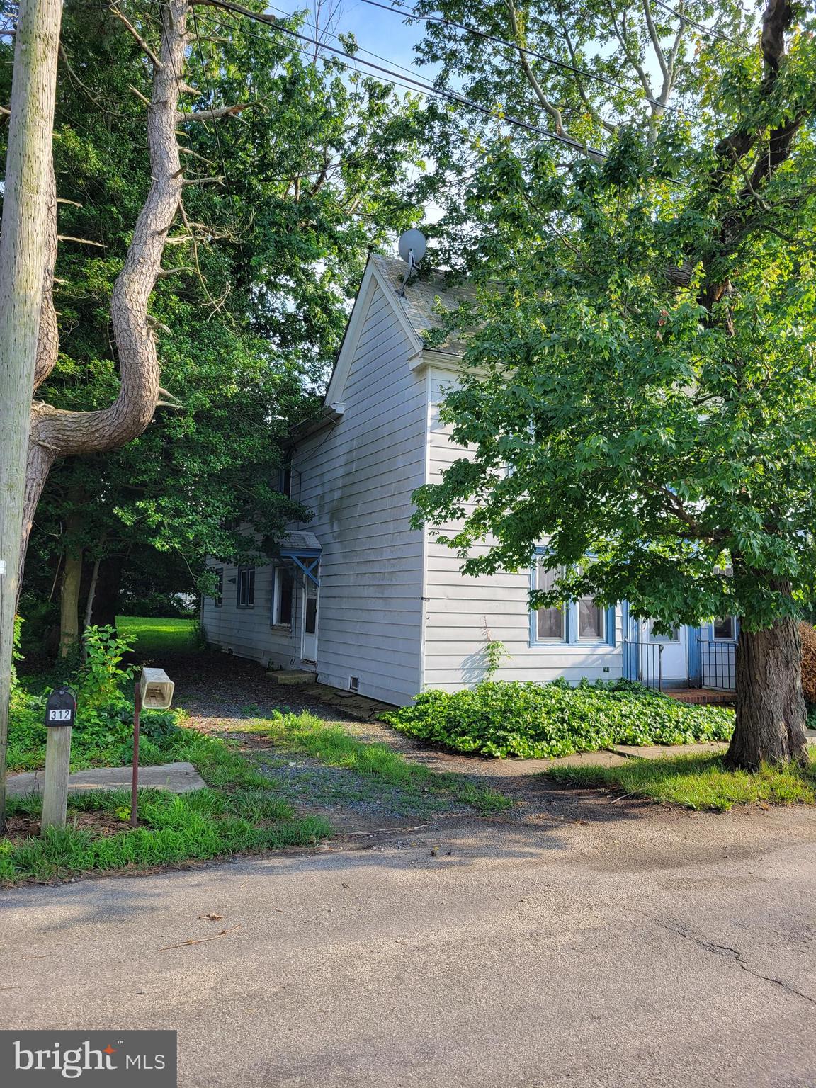 312 Front Street Dover, DE 19901 - Photo 4 of 15 a view of a house with a garden and trees